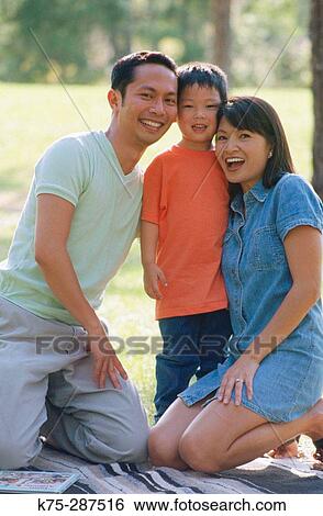 Stock Photograph - Young Chinese family. Fotosearch