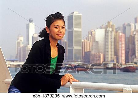 young Chinese girl aboard the ferry, Victoria Harbour between Hong-Kong Island and Kowloon peninsula, People's Republic of China, Asia View Large Photo Image Stock Photography - young Chinese girl aboard the ferry, Victoria Harbour between Hong-Kong Island and Kowloon peninsula, People's Republic of China, Asia. Fotosearch