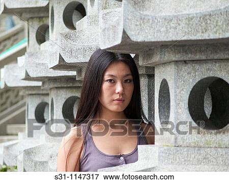 Stock Photo - young chinese woman visiting the 2010 shanghai expo. Fotosearch