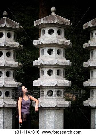 Stock Photograph - young chinese woman visiting the 2010 shanghai expo. Fotosearch