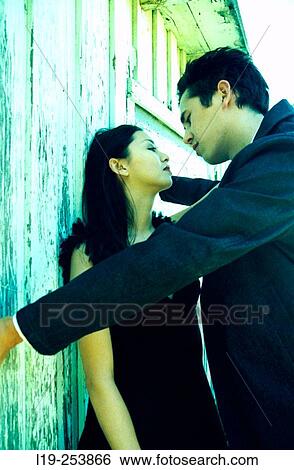 Young couple about to kiss View Large Photo Image Stock Photograph - Young couple about to kiss. Fotosearch