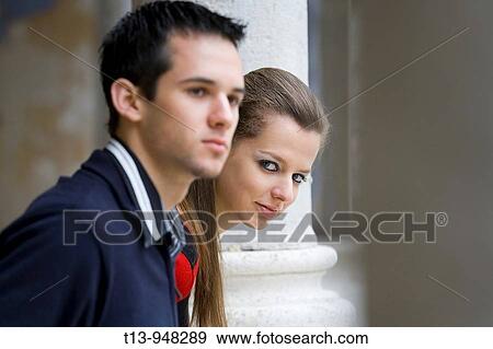 Young couple and she peeps View Large Photo Image Stock Photo - Young couple and she peeps. Fotosearch