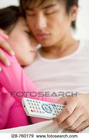 Young couple asleep on sofa, close-up View Large Photo Image Stock Photo - Young couple asleep on sofa, close-up. Fotosearch