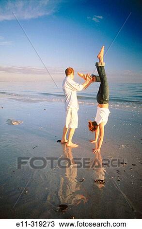 Young couple at beach View Large Photo Image Stock Image - Young couple at beach. Fotosearch