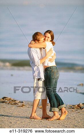 Young couple at beach View Large Photo Image Stock Photograph - Young couple at beach. Fotosearch