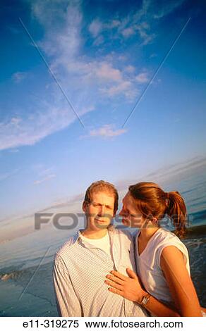 Young couple at beach View Large Photo Image Stock Photography - Young couple at beach. Fotosearch