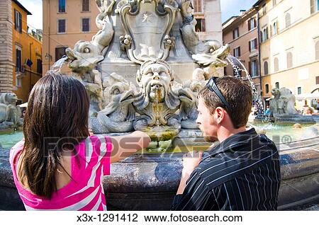 Young couple at fountain in Rome, Italy View Large Photo Image Stock Image - Young couple at fountain in Rome, Italy. Fotosearch
