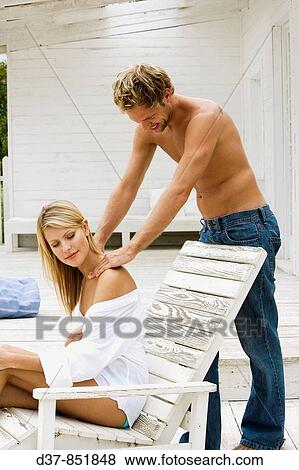 Young couple at home relaxing View Large Photo Image Stock Photo - Young couple at home relaxing. Fotosearch
