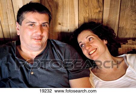 Young couple at home View Large Photo Image Stock Image - Young couple at home. Fotosearch