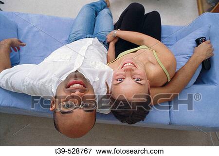 Young couple at home View Large Photo Image Stock Photo - Young couple at home. Fotosearch