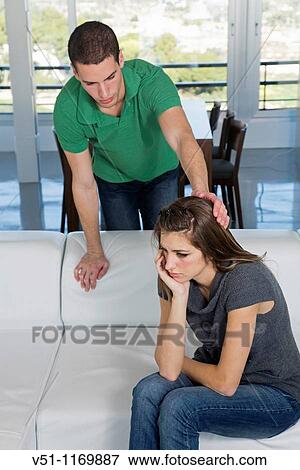 Stock Photo - Young couple at home with marital problems. Fotosearch