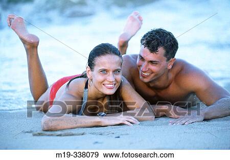 Stock Photo - young couple at the beach. Fotosearch