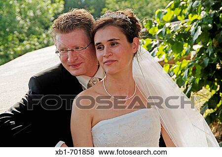 Young couple at their wedding day View Large Photo Image Stock Photo - Young couple at their wedding day. Fotosearch