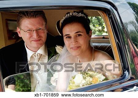 Young couple at their wedding day View Large Photo Image Stock Photo - Young couple at their wedding day. Fotosearch