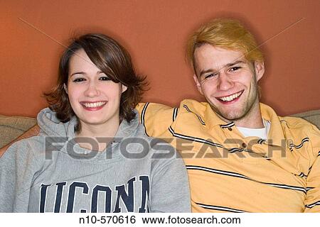 Young couple, brother and sister, posing together View Large Photo Image Stock Photograph - Young couple, brother and sister, posing together. Fotosearch