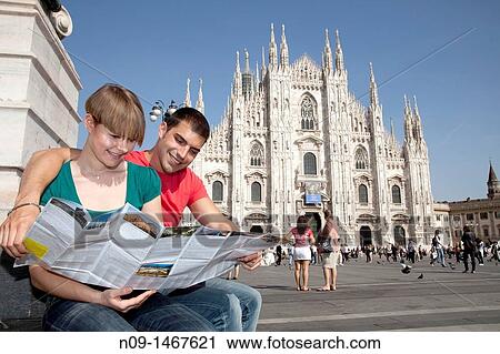 Young couple browsing a map in milan View Large Photo Image Stock Image - Young couple browsing a map in milan. Fotosearch