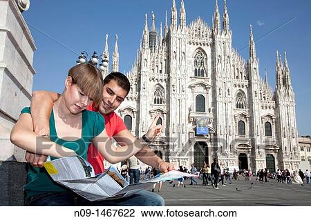 Young couple browsing a map in milan View Large Photo Image Stock Image - Young couple browsing a map in milan. Fotosearch