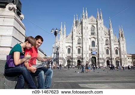 Young couple browsing a map in milan View Large Photo Image Stock Image - Young couple browsing a map in milan. Fotosearch