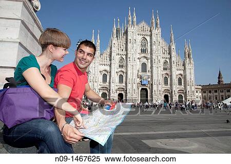 Young couple browsing a map in milan View Large Photo Image Stock Photography - Young couple browsing a map in milan. Fotosearch