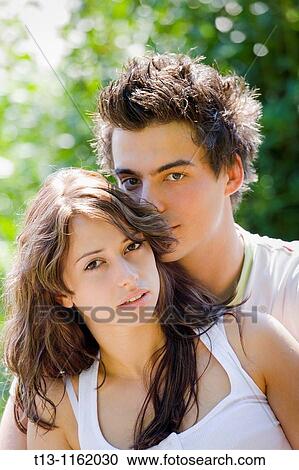 Young couple cuddling View Large Photo Image Stock Image - Young couple cuddling. Fotosearch