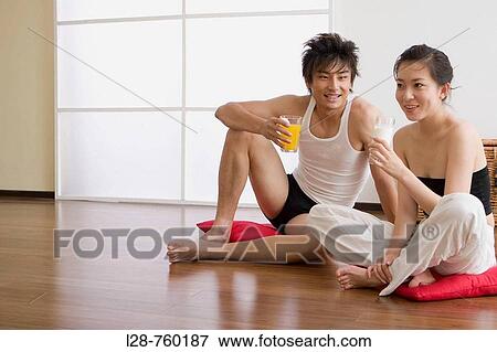 young couple drinking at home View Large Photo Image Stock Photo - young couple drinking at home. Fotosearch