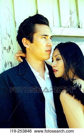 Young couple embracing View Large Photo Image Stock Photograph - Young couple embracing. Fotosearch