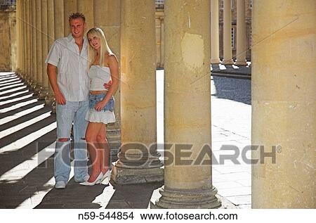 Young couple flirting amdist classic collonade. View Large Photo Image Picture - Young couple flirting amdist classic collonade.. Fotosearch