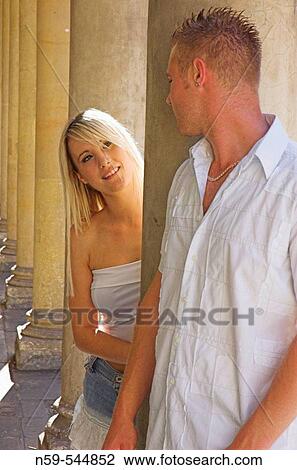 Young couple flirting amdist classic collonade. View Large Photo Image Stock Image - Young couple flirting amdist classic collonade.. Fotosearch