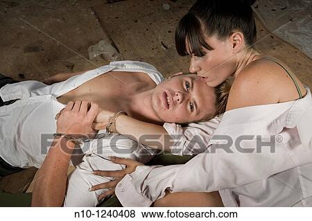 Young couple handcuffed together View Large Photo Image Stock Photo - Young couple handcuffed together. Fotosearch
