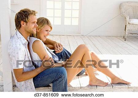 Young couple happy sitting on the floor View Large Photo Image Stock Photo - Young couple happy sitting on the floor. Fotosearch