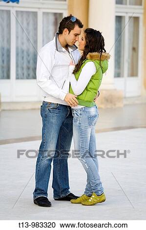 Young couple holding together on the street View Large Photo Image Stock Image - Young couple holding together on the street. Fotosearch