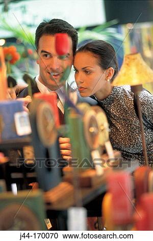 Young couple in a gift shop View Large Photo Image Stock Image - Young couple in a gift shop. Fotosearch