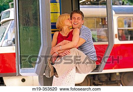 young couple in a phone booth View Large Photo Image Stock Image - young couple in a phone booth. Fotosearch