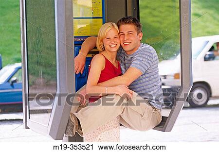 young couple in a phone booth View Large Photo Image Stock Image - young couple in a phone booth. Fotosearch