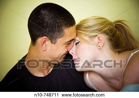 Young couple in bed together. View Large Photo Image Stock Image - Young couple in bed together.. Fotosearch