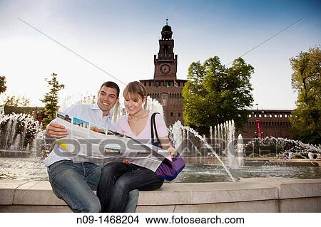 Young couple in front of the Castello Sforzesco, Milan, Italy View Large Photo Image Picture - Young couple in front of the Castello Sforzesco, Milan, Italy. Fotosearch