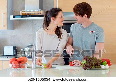 Young couple in kitchen View Large Photo Image Picture - Young couple in kitchen. Fotosearch