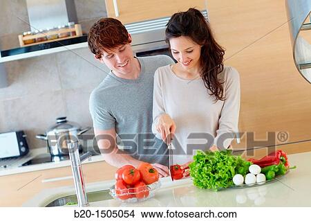 Young couple in kitchen View Large Photo Image Picture - Young couple in kitchen. Fotosearch