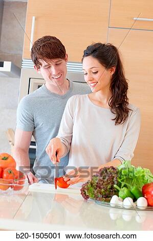 Young couple in kitchen View Large Photo Image Stock Image - Young couple in kitchen. Fotosearch