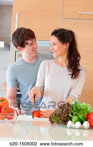 Young couple in kitchen View Large Photo Image Stock Image - Young couple in kitchen. Fotosearch