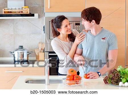 Young couple in kitchen View Large Photo Image Stock Image - Young couple in kitchen. Fotosearch