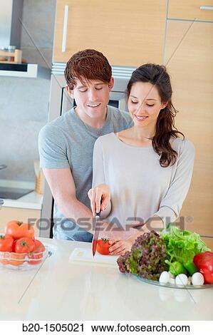 Young couple in kitchen View Large Photo Image Stock Image - Young couple in kitchen. Fotosearch