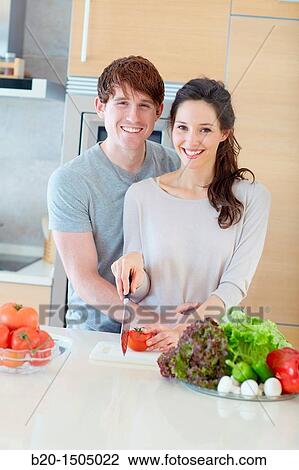 Young couple in kitchen View Large Photo Image Stock Image - Young couple in kitchen. Fotosearch