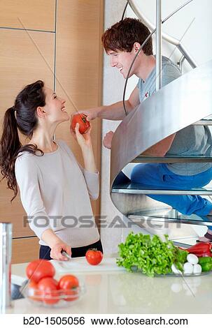 Young couple in kitchen View Large Photo Image Stock Photograph - Young couple in kitchen. Fotosearch