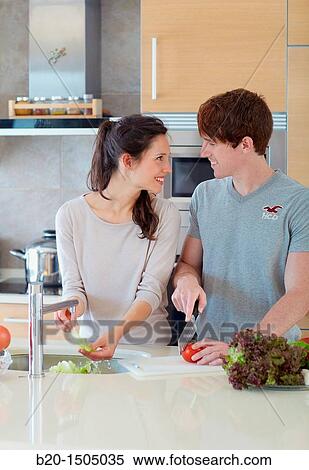 Young couple in kitchen View Large Photo Image Stock Photography - Young couple in kitchen. Fotosearch
