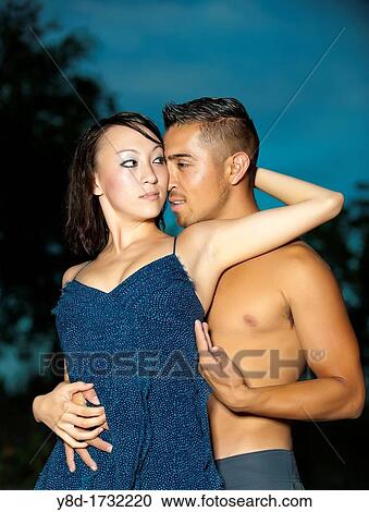 Young couple in love - Asian woman, 20 years old, Korean Ethnicity, hispanic man, 22 years old, location Frio River near Leakey, Texas, USA View Large Photo Image Stock Image - Young couple in love - Asian woman, 20 years old, Korean Ethnicity, hispanic man, 22 years old, location Frio River near Leakey, Texas, USA. Fotosearch