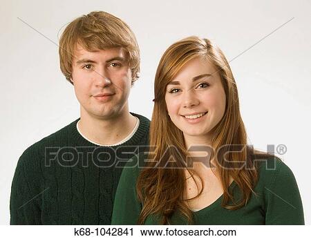 Stock Image - young couple in studio portrait. Fotosearch