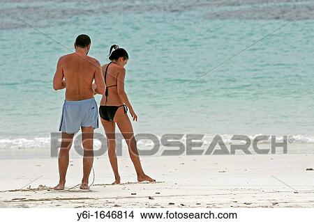 Young couple in swimsuits on beach Pattaya Beach Ko Lipe island Thailand View Large Photo Image Picture - Young couple in swimsuits on beach Pattaya Beach Ko Lipe island Thailand. Fotosearch