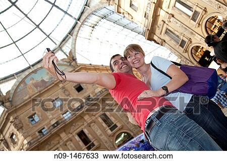 Young couple in the gallery in Milan. View Large Photo Image Stock Image - Young couple in the gallery in Milan.. Fotosearch