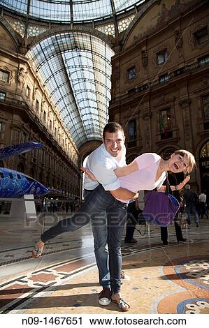 young couple in the gallery in Milan. View Large Photo Image Stock Image - young couple in the gallery in Milan.. Fotosearch